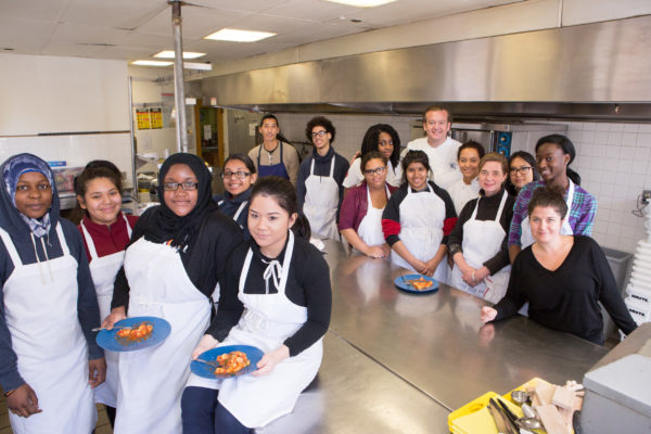 Michael White, Amador Acosta, and ExpandED Teen Apprentices enjoying scratch-made gnocchi al pomodoro