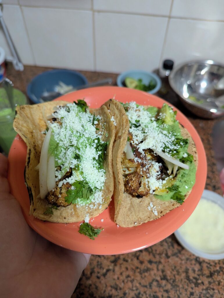 Students at Queens College make The Sylvia Center's Cauliflower Tacos from their free meal kits