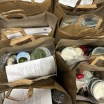 The Sylvia Center staff pack meal kit bags for Knights Table Pantry