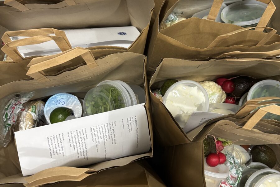 The Sylvia Center staff pack meal kit bags for Knights Table Pantry