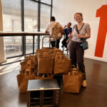 The Sylvia Center staff pack meal kit bags for Knights Table Pantry
