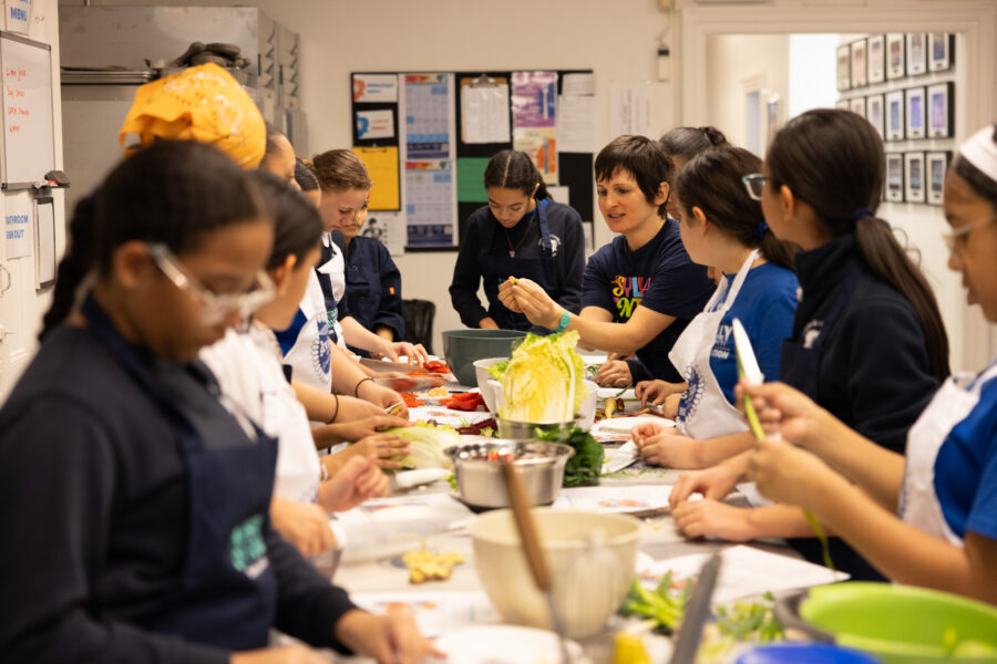 The Sylvia Center Education Programs Director Beth Bainbridge teaches students during our collaboration with Jamie Oliver