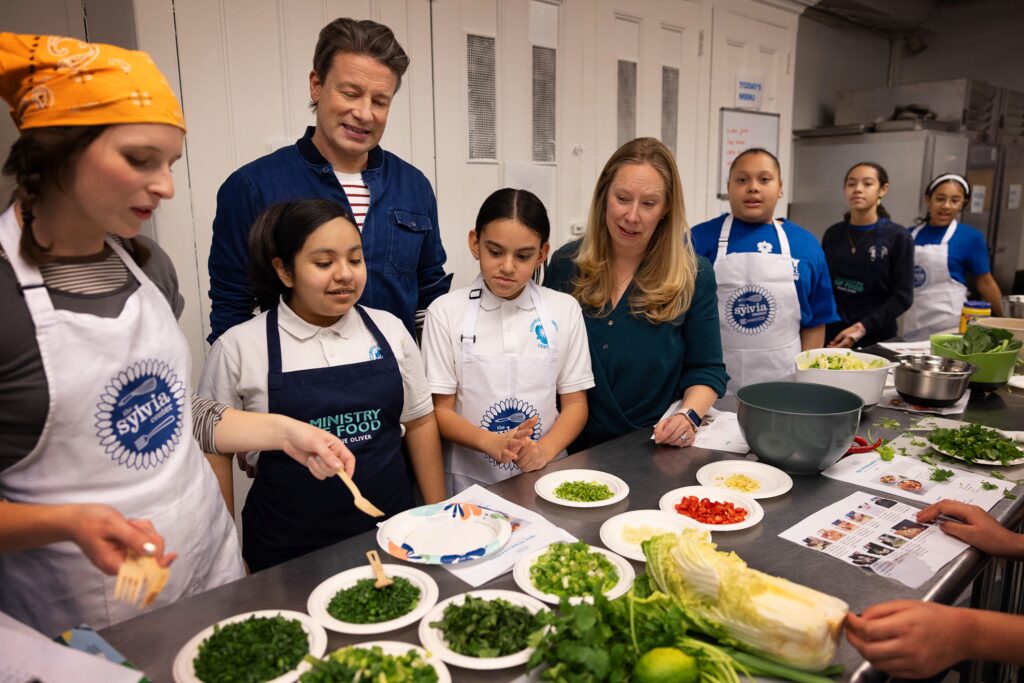 Jamie Oliver visits middle school students at Cornelia Connelly middle school on the Lower East Side