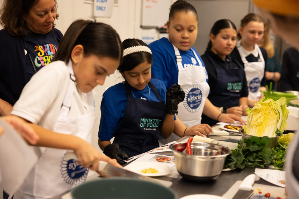 Jamie Oliver visits middle school students at Cornelia Connelly middle school on the Lower East Side