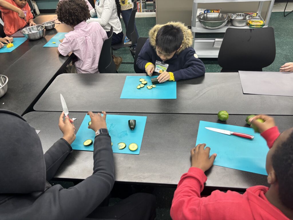 Kids in The Sylvia Center cooking class at Grand Street Settlement at Rutgers Community Center