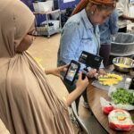 Eater's Sergio Cardigno teaches The Sylvia Center's teen culinary apprentices about food videography