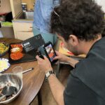 Eater's Sergio Cardigno teaches The Sylvia Center's teen culinary apprentices about food videography